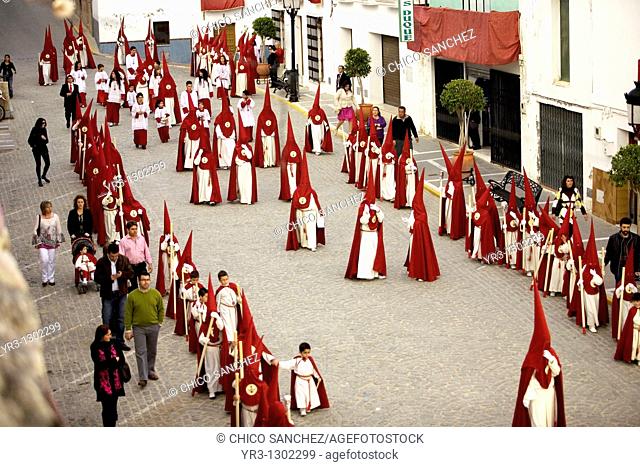 Penitents walk in a street during Easter Holy Week celebrations in Espera village, Cadiz province, Andalusia, Spain, March 31, 2010