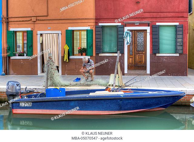 Fishermen mending net, Burano, Venice, Veneto, Italy, Europe