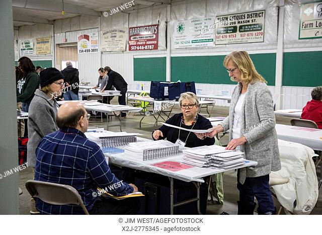 Mason, Michigan USA - 6 December 2016 - Watched by candidates' observers, workers in Ingham County, Michigan recount ballots cast in the 2016 Presidential...