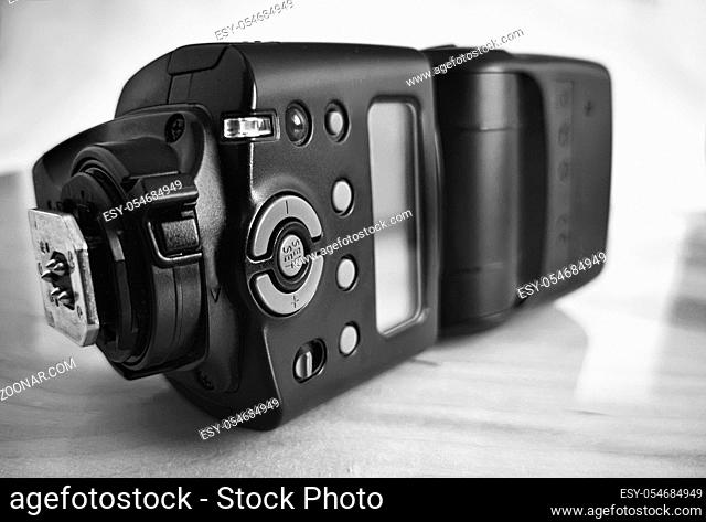 Close-up is a modern flash for a SLR camera for better lighting when shooting. Black and white image