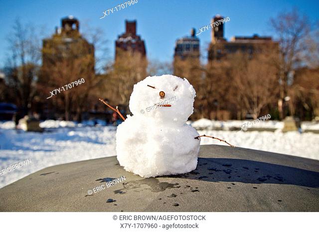 A tiny snowman in Washington Square Park in New York City