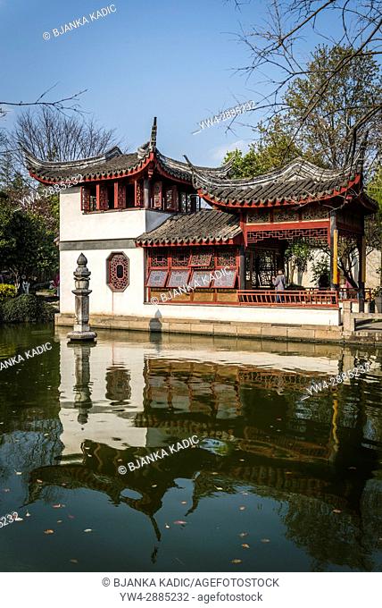 Garden Pavilion overlooking a pond, Pearl Pagoda Garden, Ancient water town of Tongli, Suzhou, Jiangsu Province, China