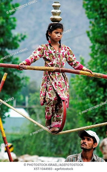 India, Kullu District, Himachal Pradesh, Northern India A travelling circus, a young girl on a tight rope