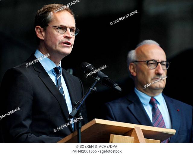 The French Ambassador to Germany, Philippe Etienne (R), stands next to Berlin Mayor Michael Mueller (L) on the stage of the German-French Festival in Berlin