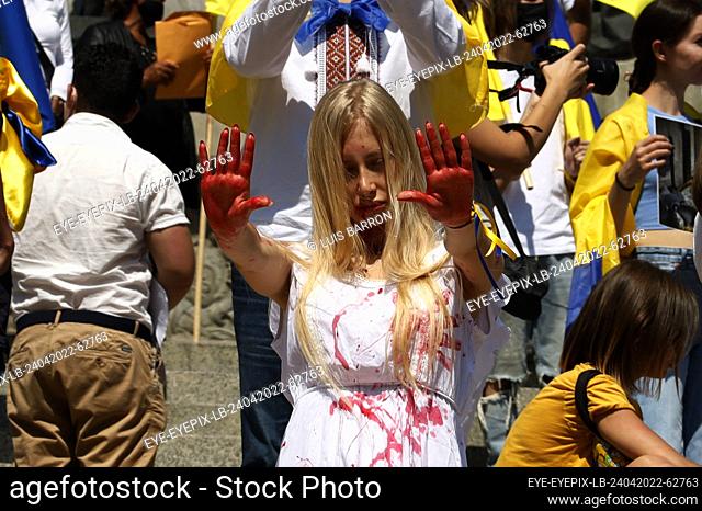 MEXICO CITY, MEXICO - APR 24, 2022: Ukrainians citizens, take part during a strike at Independence Angel Monument to demand a halt to the invasion and killings...