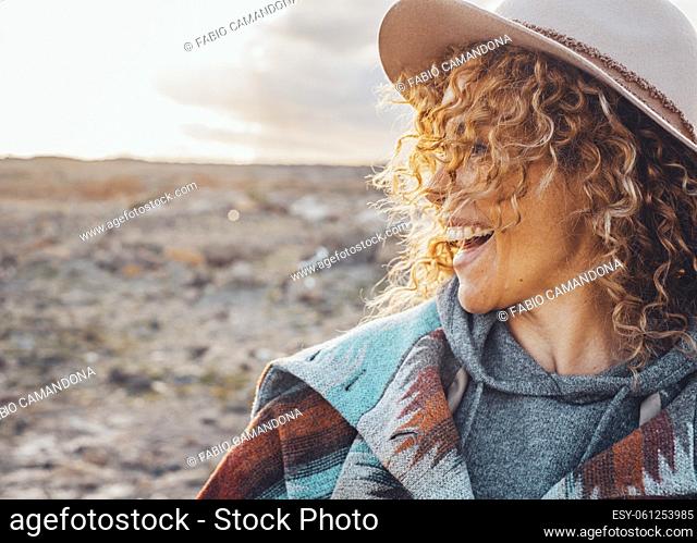 Side portrait of overjoyed and excited cheerful pretty woman with curly blonde hair and hat have fun in outdoor travel leisure activity