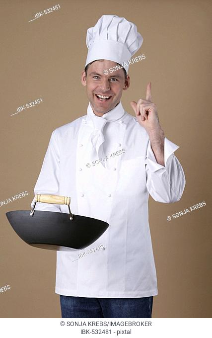 Cook with pan in the hand