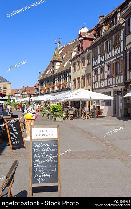 Old town with restaurants and historic buildings, here pedestrian street Rue du Marche, Obernai, Alsace, France, Europe