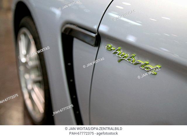 A green Panamera S logo on a Porsche Panamera S E Hybrid during an electromobility conference in Leipzig (Saxony), Germany, 14 April 2016