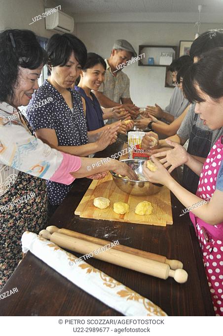 Naha, Okinawa, Japan: Japanese people making fresh pasta during an Italian cooking class