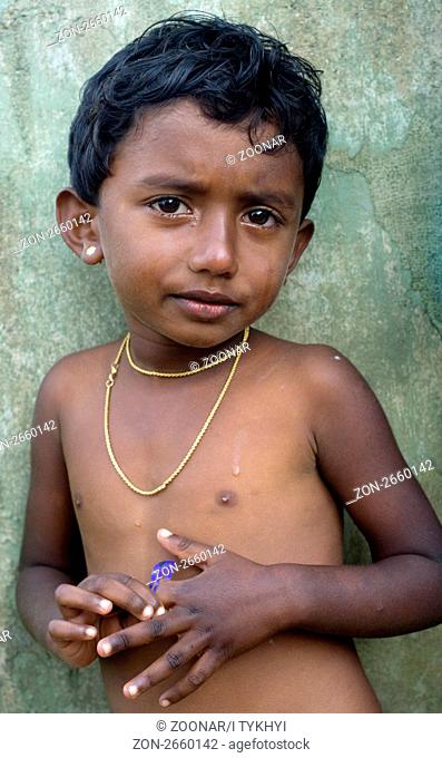 Neluwa, Sri Lanka - January 27, 2011: Portrait of a littlel Sri Lankan girl from small village in Sinharaja Rain Forest. Sinharaja Rain Forest is the last...