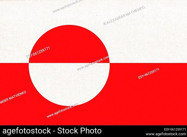 Flag of Greenland. Greenland flag on fabric surface. Fabric texture. National symbol. Flag of island Greenland