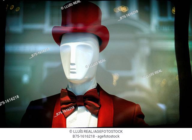 mannequin man behind a shop window