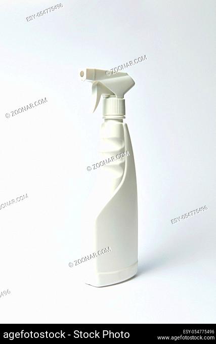 Plastic blank white bottle for liquid on a light gray background, mock-up. Place for text