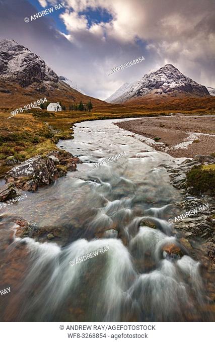 Lagangarbh Cottage near the top of the Pass of Glen Coe in Scotland, captured from the bridge over the River Coupall on an atmospheric afternoon in early...