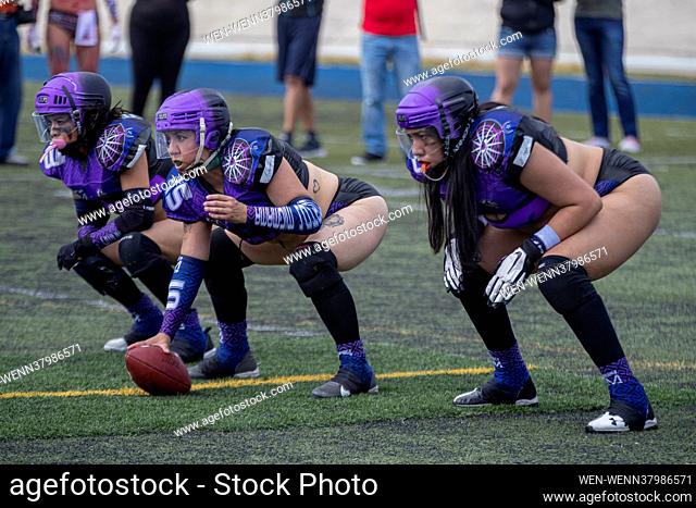 MEXICO CITY, MEXICO - JULY 11: A player of NYX centers the ball during the match between IXUS- Lingerie Football Team and NYX - Lingerie Football Team of Diosas...