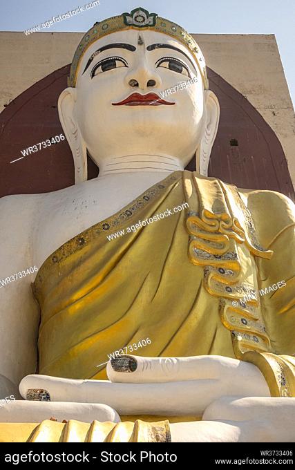 The large Buddha statue in the Kyaik Pun Pagoda a small Buddhist monastery near the town of Bago, Myanmar