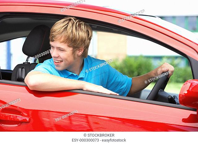 Teenage Boy Sitting In Car