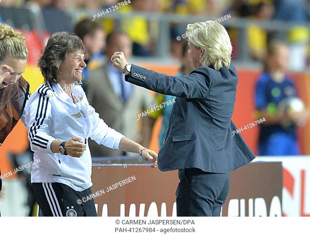 Head coach Silvia Neid (r) and assistant coach Ulrike Ballweg of Germany reacts after the UEFA Women«s EURO 2013 semi final soccer match between Germany and...