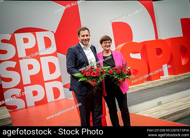 08 December 2023, Berlin: Lars Klingbeil, SPD Federal Chairman, and Saskia Esken, SPD Federal Chairwoman, stand on the podium at the SPD's regular federal party...