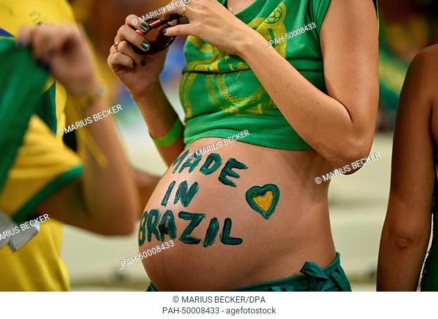 A pregnant soccer fan of Brazil with a slogan on her belly reading 'Made in Brazil' before the FIFA World Cup 2014 quarter final match soccer between Brazil and...