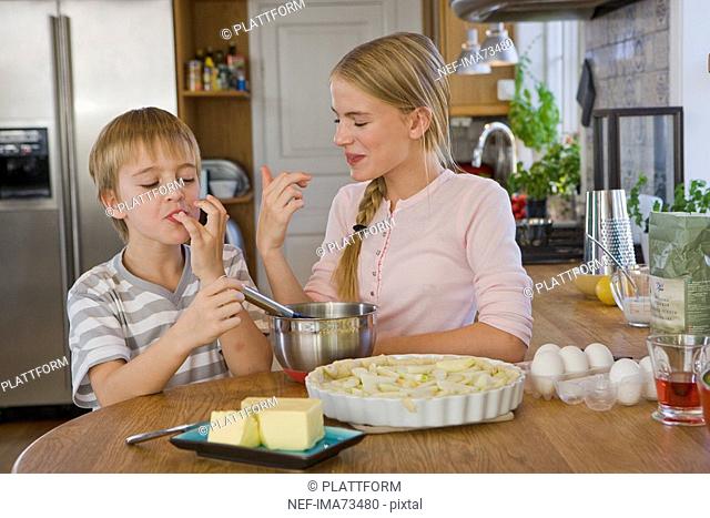 Sister and brother making a cake, Sweden