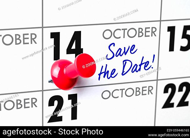 Wall calendar with a red pin - October 14