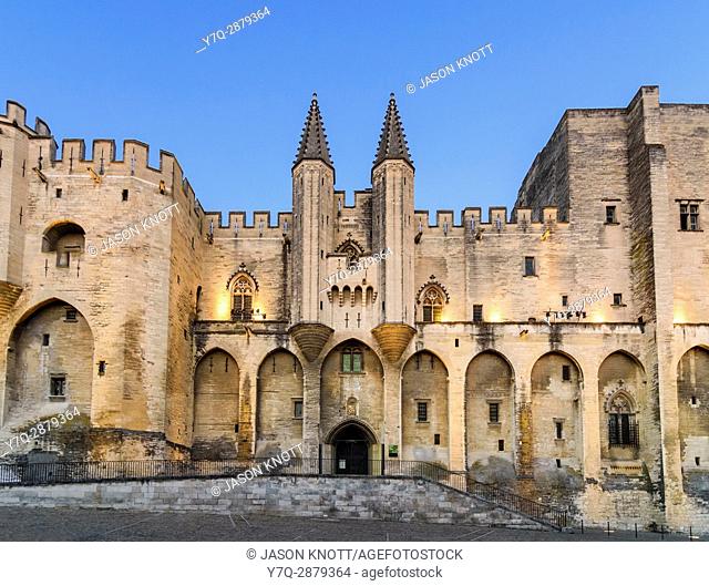 Evening light over the Gothic twin towered facade of the Palais Neuf, Palais des Papes, Palace Square, Avignon, Vaucluse, Provence-Alpes-Cote d'Azur, France