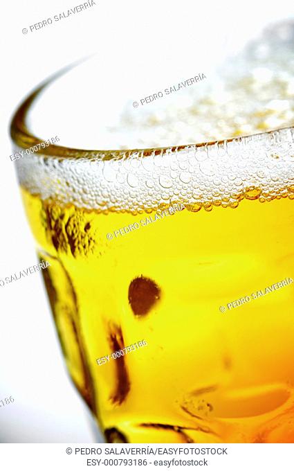 foreground of a refreshing pitcher of beer