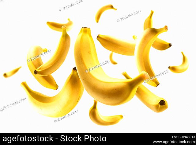 Yellow bananas levitate on a white background