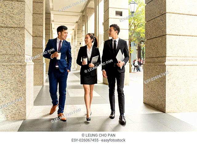 Group of business people walking in the street