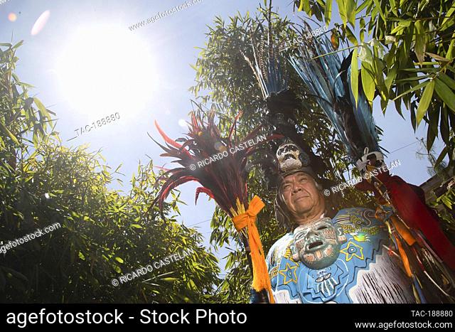 TEOTIHUACAN, MEXICO - AUGUST 26: A man poses dressed as aztec warrior front a Temazcal as part of a pre-hispanic ceremony at archeological zone