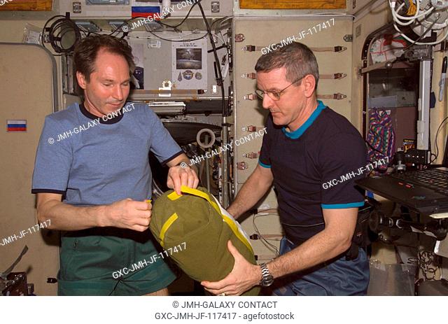 Cosmonaut Valery I. Tokarev (left), Expedition 12 flight engineer representing Russia's Federal Space Agency, and astronaut William S