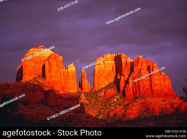 Sunset storm light illuminating Cathedral Rocks, Sedona Area, Coconino National Forest, Arizona