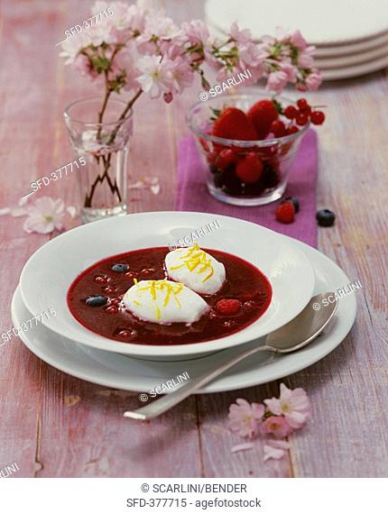 Jellied berry soup with poached meringues