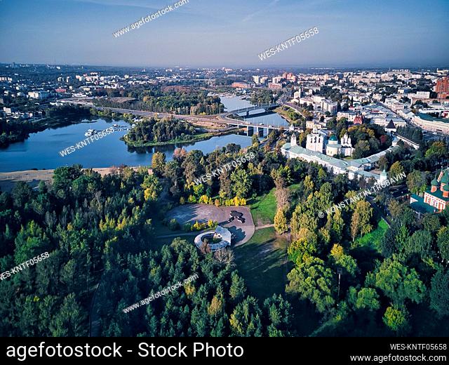 Aerial view of Yaroslavl Museum-Reserve and Spaso-Preobrazhensky Monastery by Kotorosl river in city against sky on sunny day, Yaroslavl, Russia