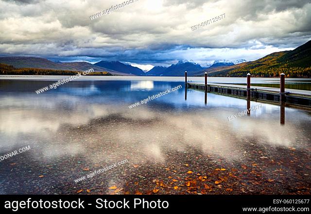 The dock on Lake MacDonald in Glacier National Park in Montana, USA on a n overcast day in late afternoon light in autumn