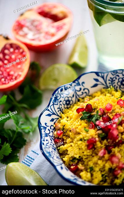 Vegeterian dish, couscous salad with pomegranate seeds