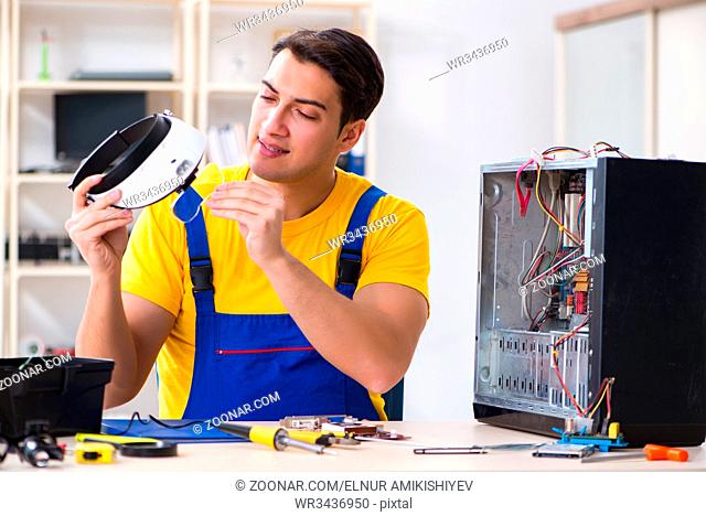 Computer repair technician repairing hardware