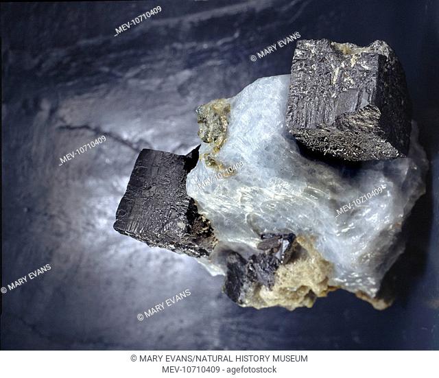 Large black, pseudocubic crystals of perovskite (calcium titanium oxide). It is a source of titanium and some rare earth metals