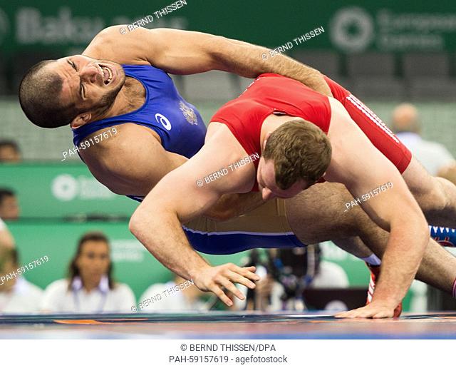 Germanys Oliver Hassler (rr, red) and Islam Magomedov of Russia compete in the men's 98kg Greco-Roman wrestling qualification in Baku, Azerbaijan, 13 June 2015