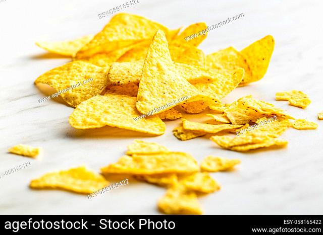 Tortilla chips. Mexican nacho chips on kitchen table