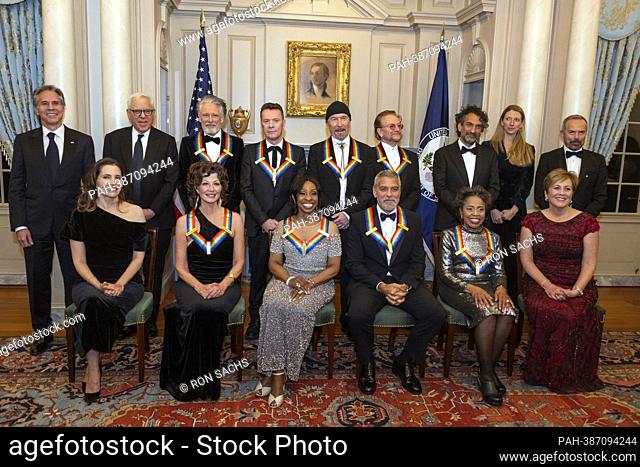 The recipients of the 45th Annual Kennedy Center Honors pose for a group photo following the Artists Dinner at the US Department of State in Washington, D