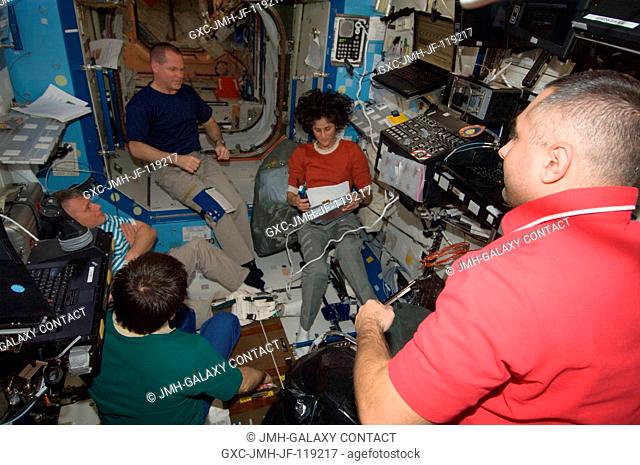 Expedition 33 crew members are pictured in the Destiny laboratory of the International Space Station. Pictured clockwise (from top right) are NASA astronaut...