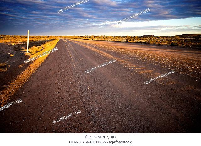 A dirt road in the outback at sunset, Western Australia. (Photo by: Auscape/UIG)