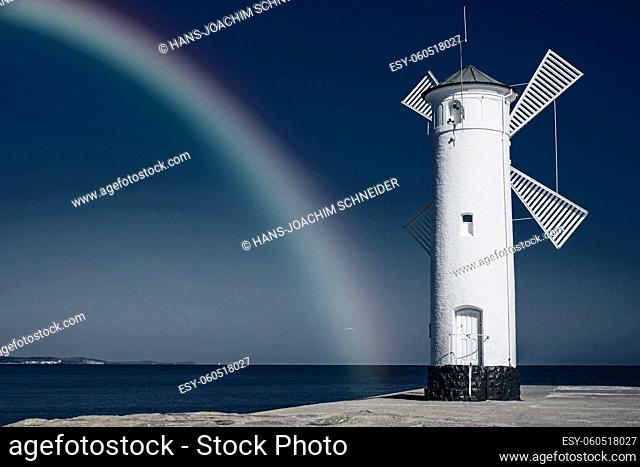 Swinoujscie, town's landmark with rainbow in infrared