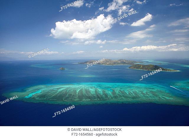 Aerial view of barrier reef of Malolo Island centre and Castaway Island right, Mamanuca Islands, Fiji