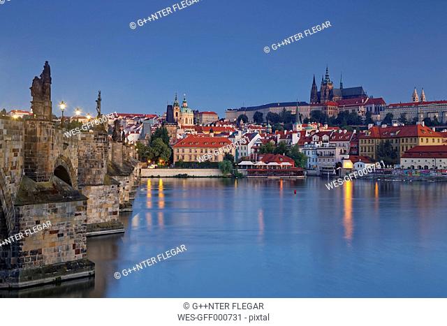 Czech Republic, Prague, Old town, Charles Bridge, Prague Castle and St. Vitus Cathedral in the evening