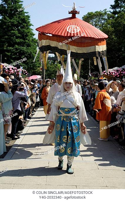 Asakusa, Tokyo, Kannon Temple, Sensoji Temple, First day Sanja Matsuri, White heron, Temple spirit, Crowds, Attendants, Vertical, Red ceremonial parasol