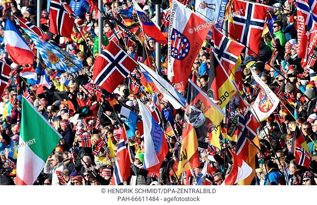 Spectators of Russia and Norway celebrate during the Women 4x6 km Relay competition at the Biathlon World Championships, in the Holmenkollen Ski Arena, Oslo